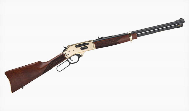 Henry Big Boy lever-action rifle with brass receiver, blued octagonal barrel, and walnut stock on a white background.