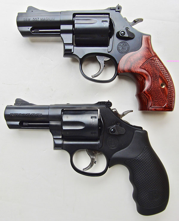 Two S&W .357 Magnum revolvers with 3-inch barrels, one with wood grips and one with rubber grips