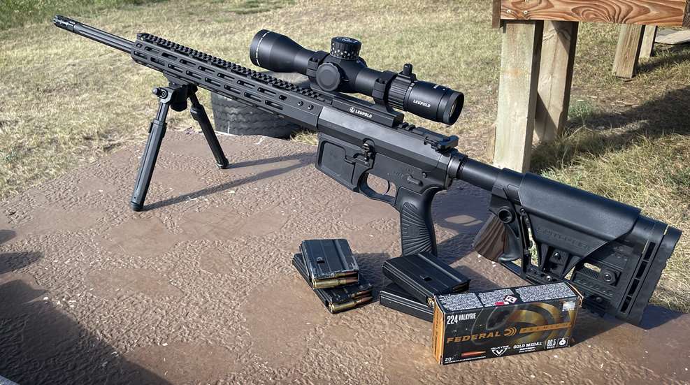 AR-15 rifle in .224 Valkyrie with Leupold scope on bipod, with Federal Gold Medal 224 Valkyrie ammunition box and loaded magazines on a shooting bench.