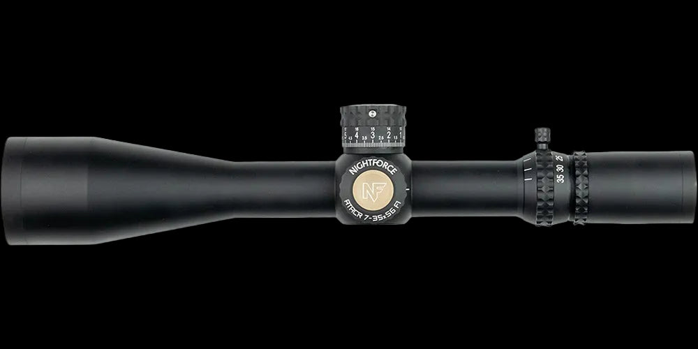 Nightforce ATACR 7-35x56 F1 riflescope on a black background, showing the turret housing and magnification ring.