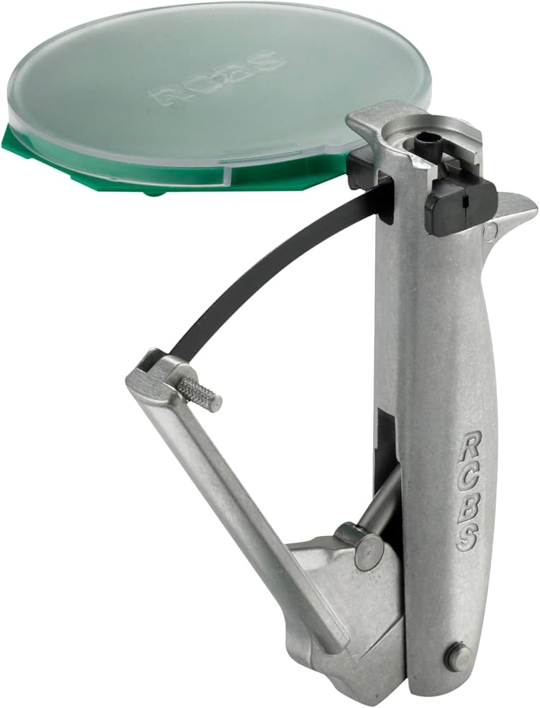 RCBS hand priming tool with green circular primer tray and metal squeeze handle on white background.
