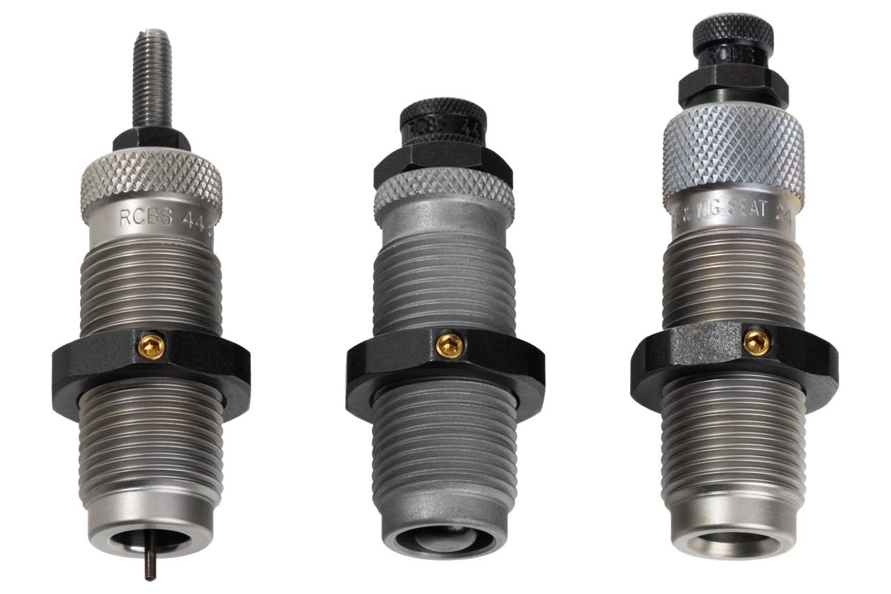 Three RCBS reloading dies for pistol caliber arranged side by side on white background, showing sizer, expander, and seater dies with knurled adjustment collars and locking rings.