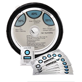 Circular humidity indicator disc showing 30%, 40%, and 50% relative humidity zones alongside humidity indicator cards and strips.