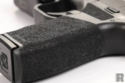 The textured polymer frame of the Hellcat Pro for secure handling.