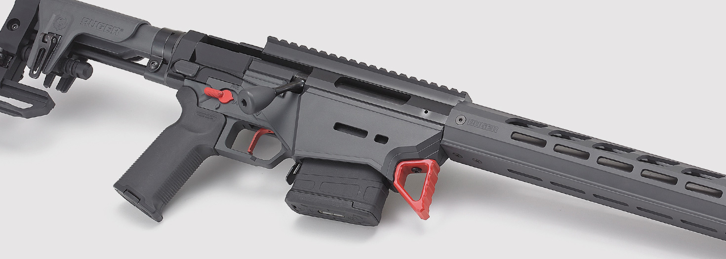 Ruger Precision Rifle with M-LOK handguard, detachable magazine, and red-accented controls, shown on white background