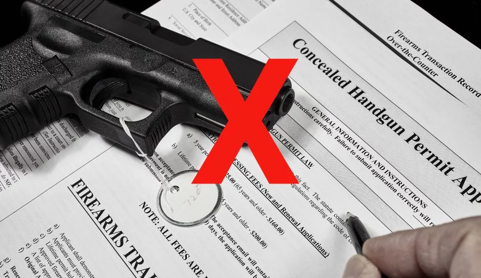A polymer-framed semi-automatic pistol resting on a concealed handgun permit application and firearms transaction record, overlaid with a large red X.