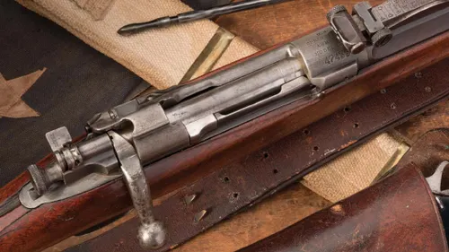 The Springfield M1903 rifle alongside the .30-06 cartridge.
