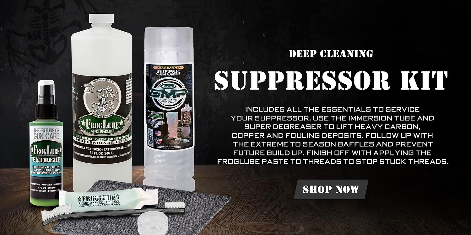 FrogLube Deep Cleaning Suppressor Kit with Super Degreaser bottle, Extreme spray lubricant, paste, immersion tube, and brushes arranged on a mat.