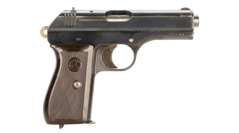 Left-side view of a CZ vz. 27 semi-automatic pistol with blued steel finish and brown checkered grip panels on a white background.