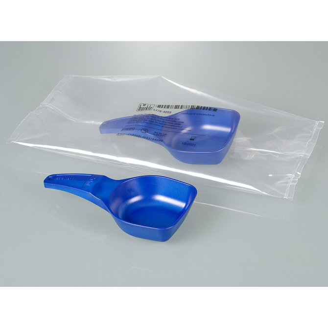 Blue plastic powder measuring scoop shown outside and inside its sterile packaging on a gray surface.