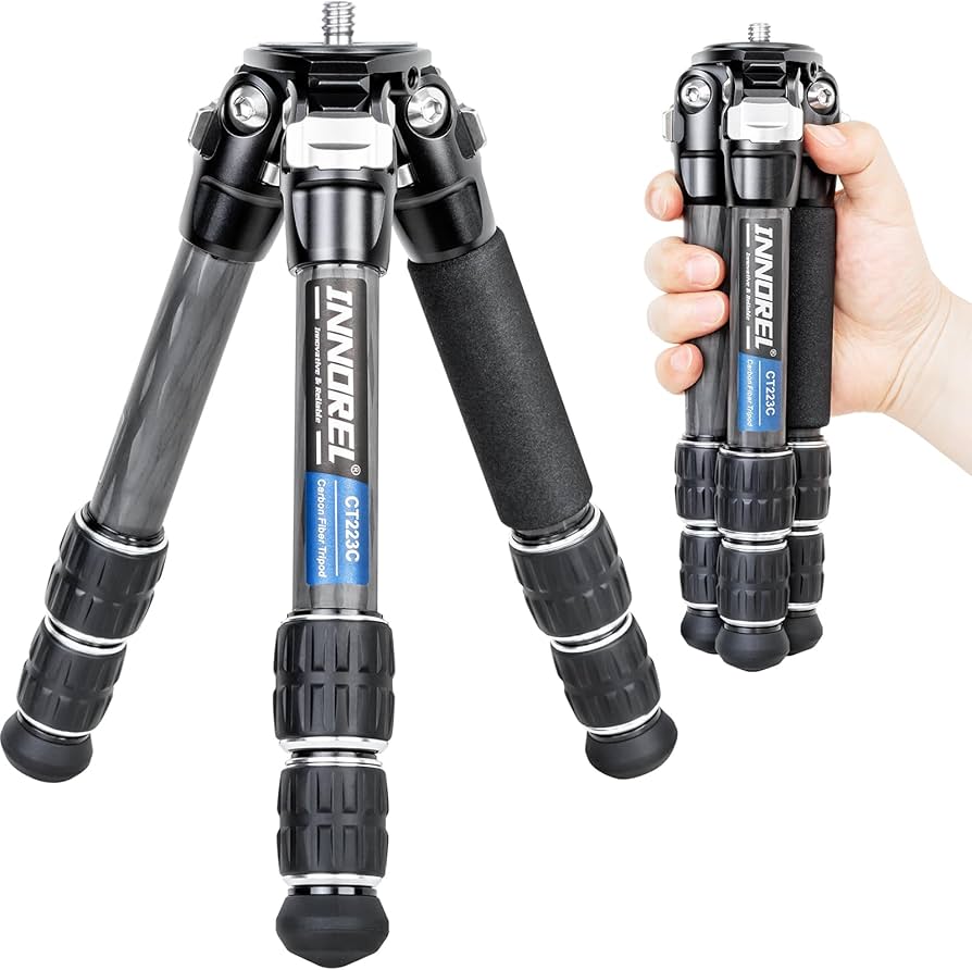 Innorel CT223C compact carbon fiber tripod shown deployed and collapsed in hand for size comparison