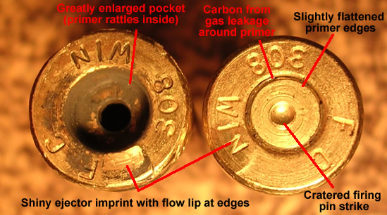 Two .308 WIN brass case heads annotated to show overpressure signs: enlarged primer pocket, carbon leakage, cratered primer, and ejector marks.
