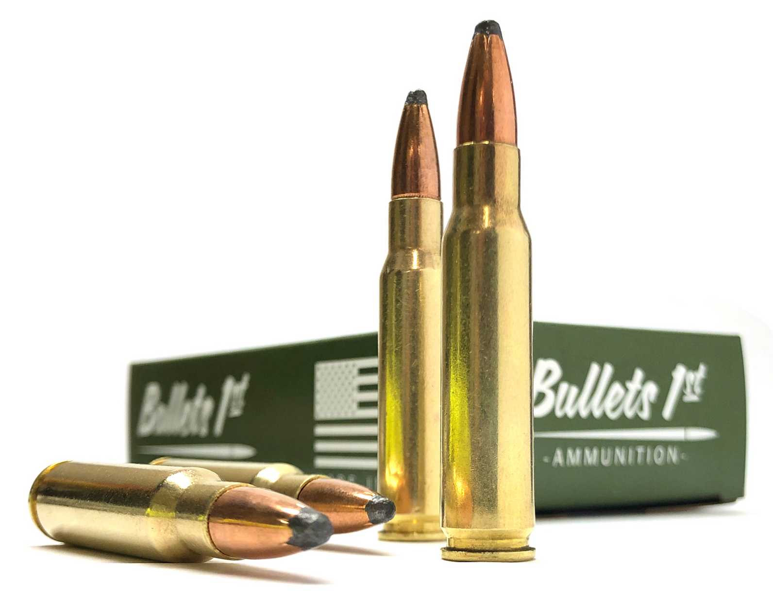 Four Bullets 1st soft-point rifle cartridges displayed in front of their olive-green ammunition box