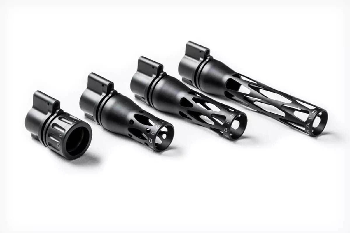 Four black anodized adjustable gas blocks of increasing length arranged side by side on a white background, with skeletonized cutouts and set screw ports visible.