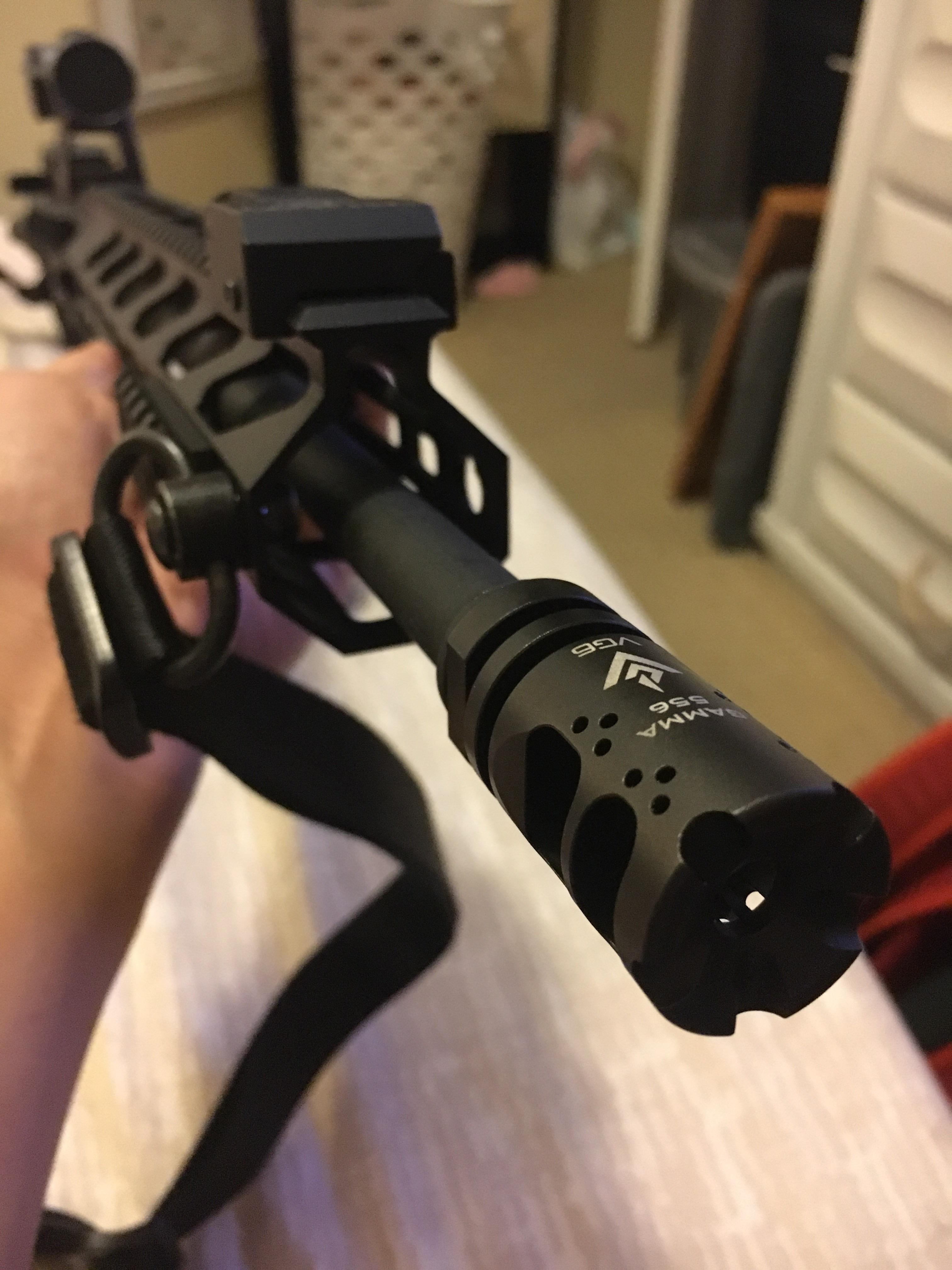 VG6 Gamma 556 muzzle brake/compensator mounted on an AR-15, close-up view showing aggressive porting