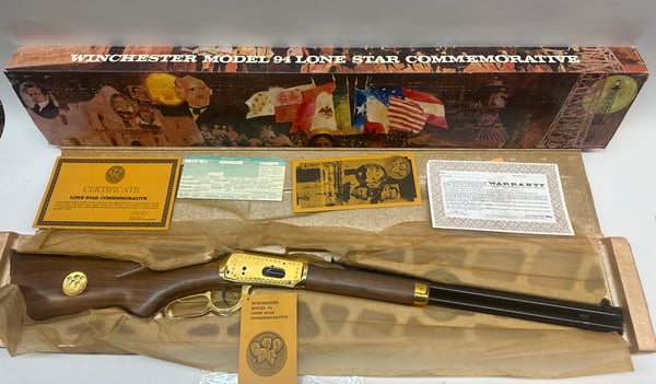 Winchester Model 94 Lone Star Commemorative rifle displayed in original box with certificate and warranty papers