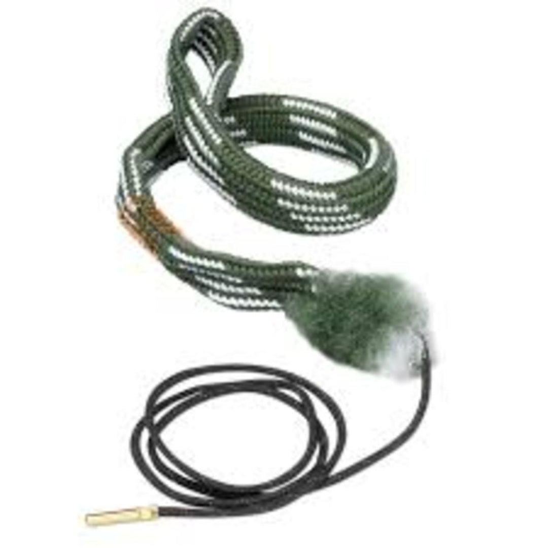 Coiled bore snake with brass weight on pull cord, woven green body with bronze brush section, and fluffy mop tail for bore cleaning.